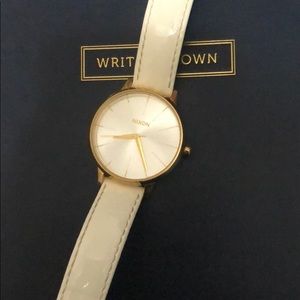 Nixon white and gold watch
